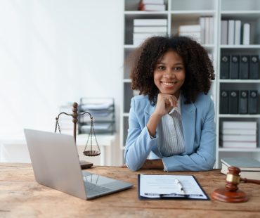 A young women African American lawyer lawsuit studying cases for clients in a law firm to fight against their parties in the courts. law and attorney concepts